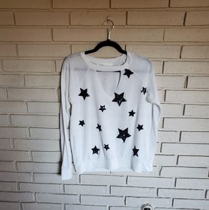 White sweater with black stars